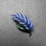 Brooch Branch with blue cat's eye, green enamel, golden metal 22x47mm