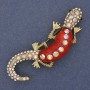 Brooch Lizard with red effect and crystals, white and pink rhinestones, golden metal 24x71mm