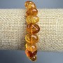 Bracelet Crystal Orange, amber-tone glass beads faceted 12x8mm, stretchy length 18cm