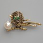 Brooch pendant Bird with green rhinestones, white bead golden metal 46x24mm