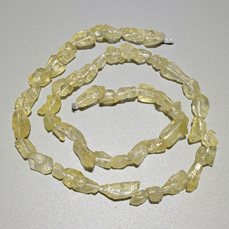 Citron-shaped Quartz Beads natural stone faceted, diameter 6x9mm±, length 40cm± on thread