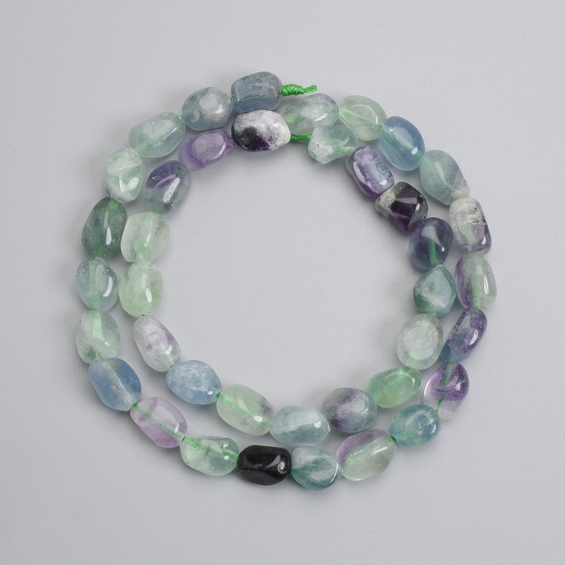 Fluorite beads tumbled 9-11x7-8mm+-, length 39cm+- on a string